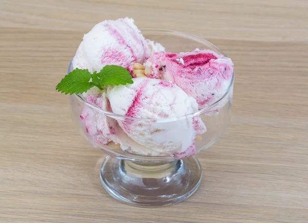 Ice cream with cedar and mint leaves — Stock Photo, Image