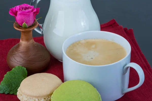 Coffee with macaroons and milk