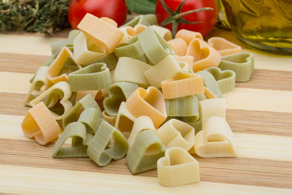 Raw heart-shaped pasta — Stock Photo, Image