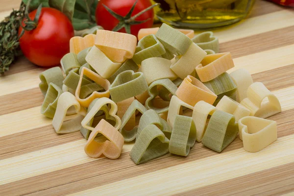 Raw heart-shaped pasta — Stock Photo, Image