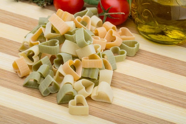 Raw heart-shaped pasta — Stock Photo, Image