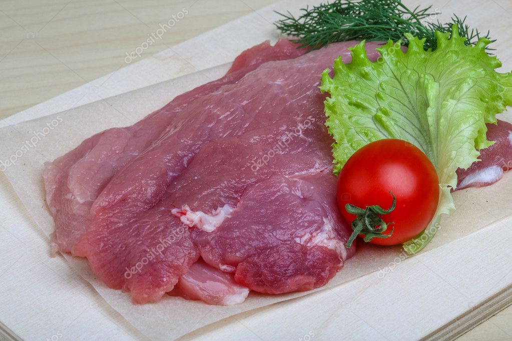 Raw pork schnitzel Stock Photo by ©AndreySt 74030431