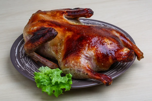 Roasted duck on the wood background — Stock Photo, Image