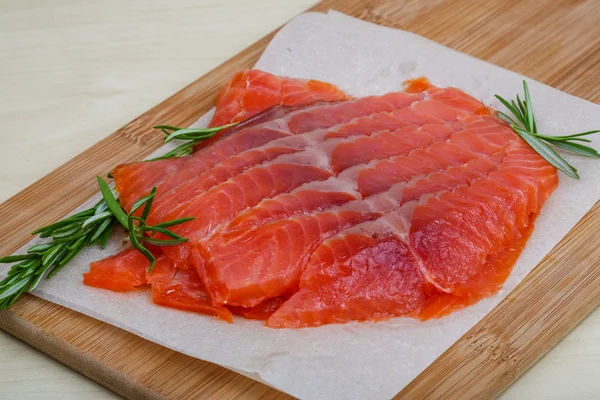 Sliced salmon with rosemary — Stock Photo, Image