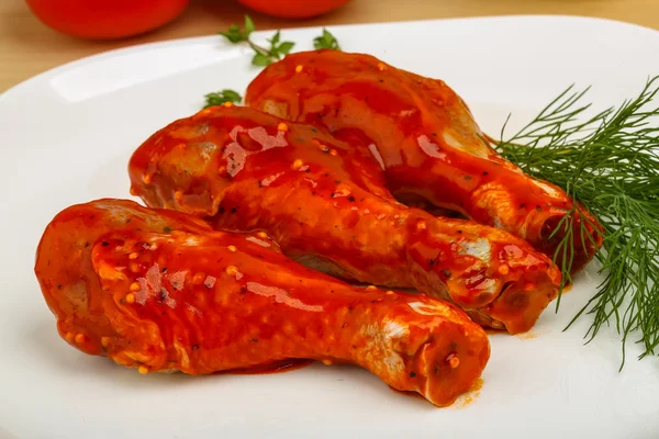 Chicken legs in red tomato — Stock Photo, Image