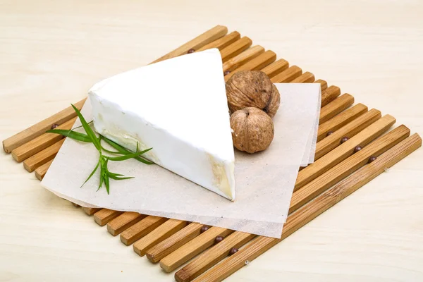 Brie cheese with walnut and tarragon — Stock Photo, Image