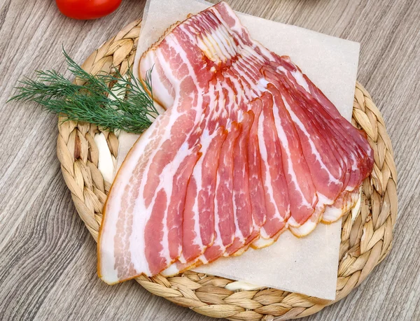 Sliced bacon on woode — Stock Photo, Image