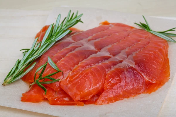 Sliced salmon with rosemary — Stock Photo, Image