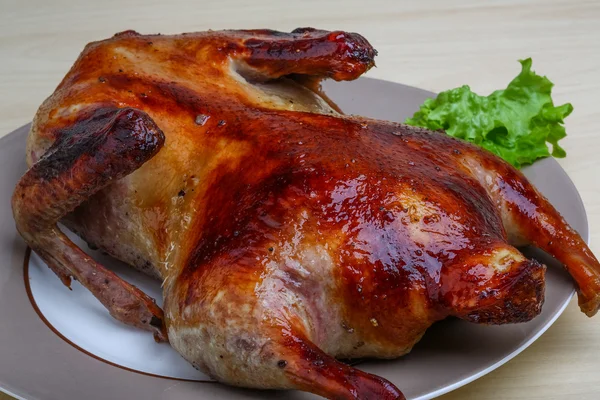 Roasted duck on the wood background — Stock Photo, Image