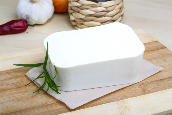 Feta cheese piece with tarragon — Stock Photo, Image
