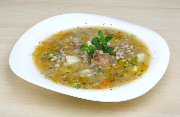 Cereal soup with pork meat — Stock Photo, Image