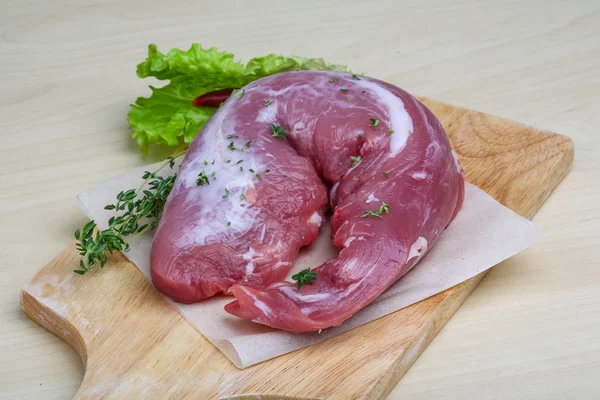 Raw pork tenderloin with thyme — Stock Photo, Image