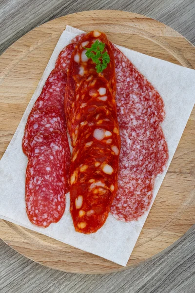 Salami sausage with parsley — Stock Photo, Image