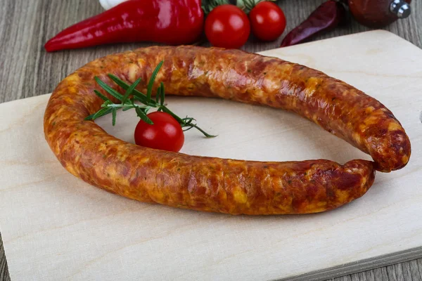 Sausage ring with vegetables — Stock Photo, Image