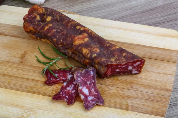 Salami sausage with rosemary — Stock Photo, Image
