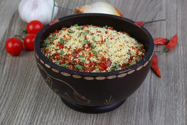 Raw couscous in the bowl — Stock Photo, Image