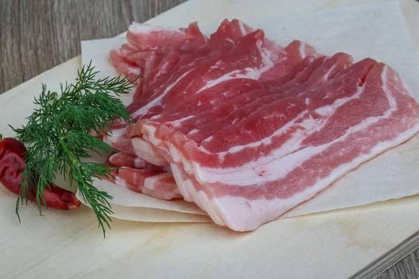 Raw bacon with dill — Stock Photo, Image