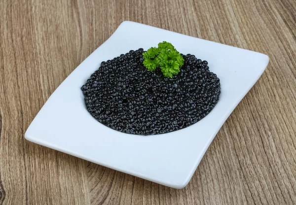 Black caviar in the bowl — Stock Photo, Image