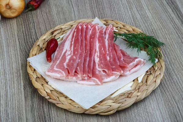 Raw bacon with dill — Stock Photo, Image