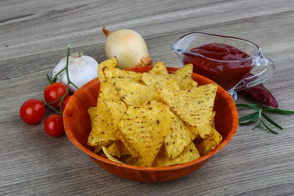 Nachos chips with tomato hot sauce — Stock Photo, Image
