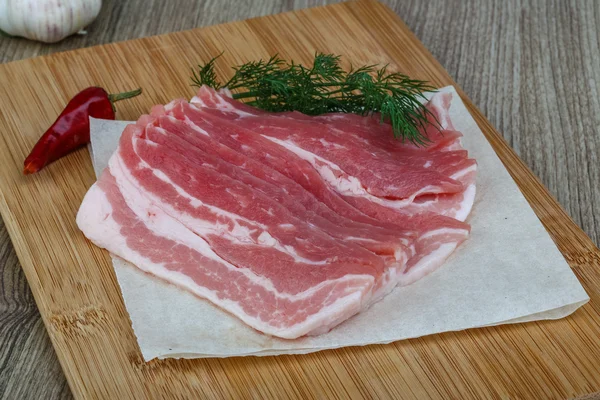 Raw bacon slices — Stock Photo, Image