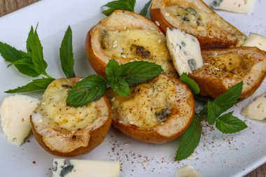 Baked pear with blue cheese clipart