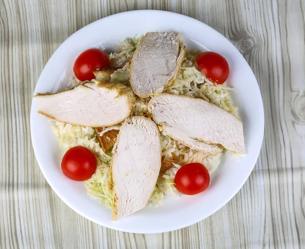Caesar salad with chicken breast