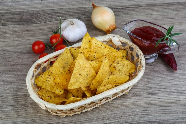 Nachos chips with tomato hot sauce — Stock Photo, Image