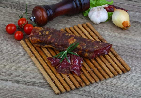 Salami sausage with rosemary — Stock Photo, Image