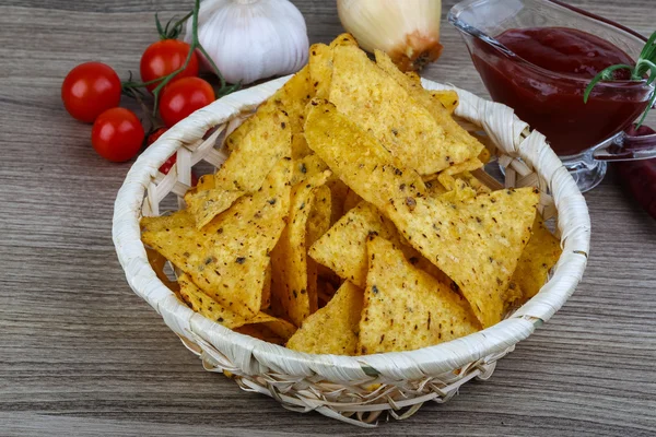 Nachos chips with tomato hot sauce — Stock Photo, Image