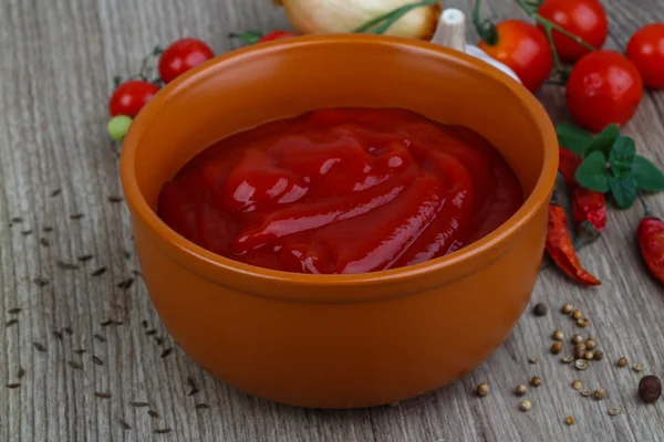 Tomato ketchup with herbs — Stock Photo, Image