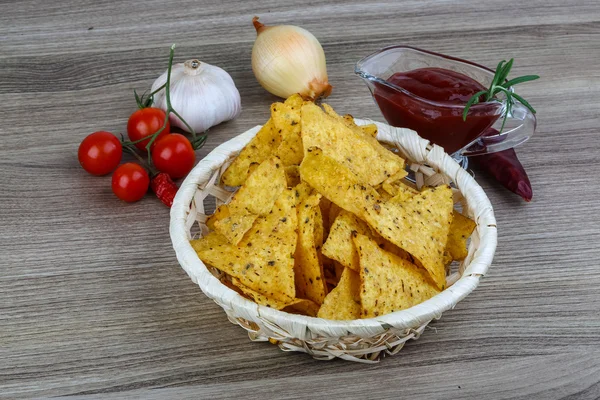 Nachos chips with tomato hot sauce — Stock Photo, Image