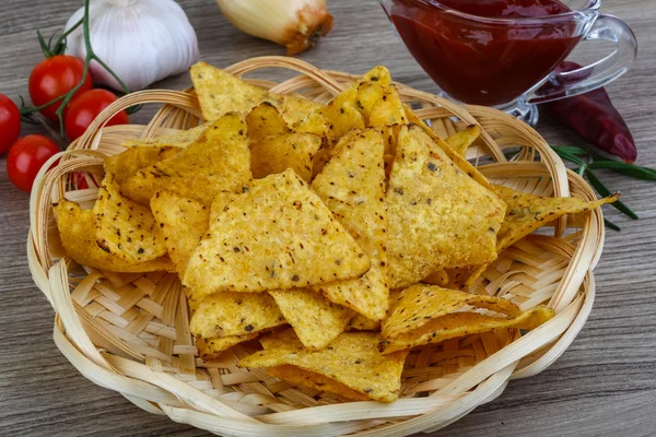 Nachos chips with tomato hot sauce — Stock Photo, Image