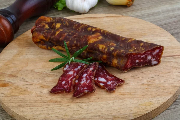 Salami sausage with rosemary — Stock Photo, Image