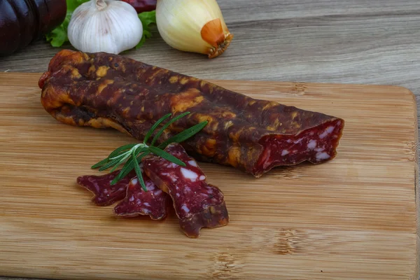 Salami sausage with rosemary — Stock Photo, Image