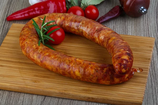Sausage ring with cherry tomatoes — Stock Photo, Image