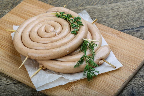 Round sausage with thyme — Stock Photo, Image