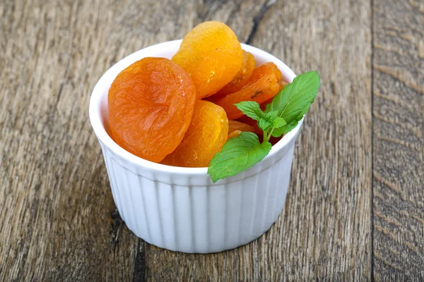 Dried apricots in the bowl — Stock Photo, Image