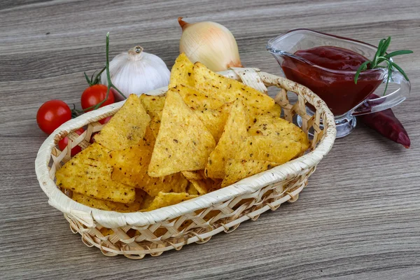 Nachos chips with tomato sauce — Stock Photo, Image