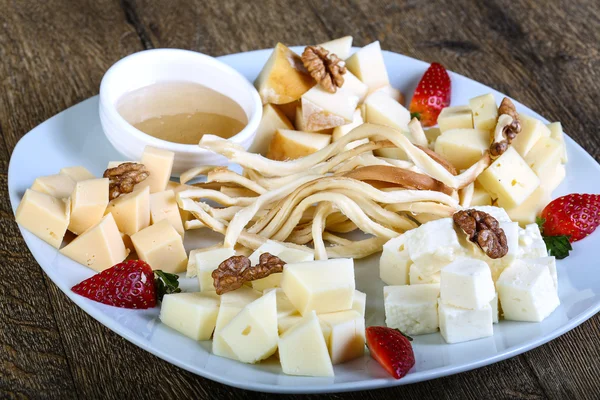 Cheese board with walnut — Stock Photo, Image