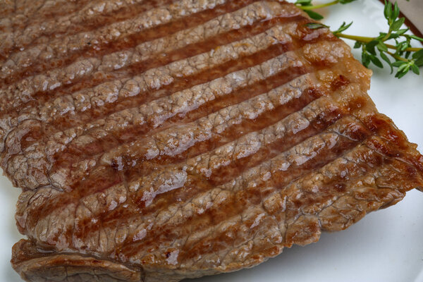 Grilled beef steak with herbs and spices