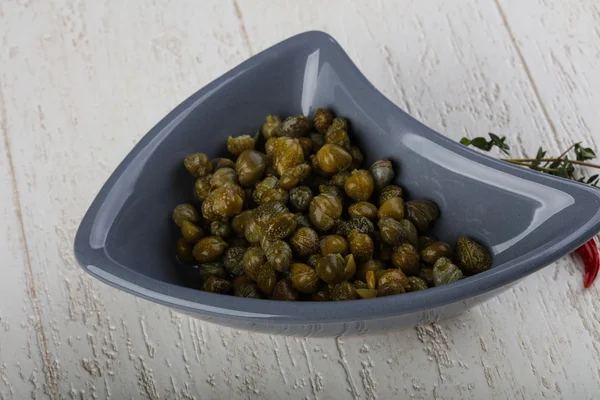 Pickled capers in the bowl — Stock Photo, Image