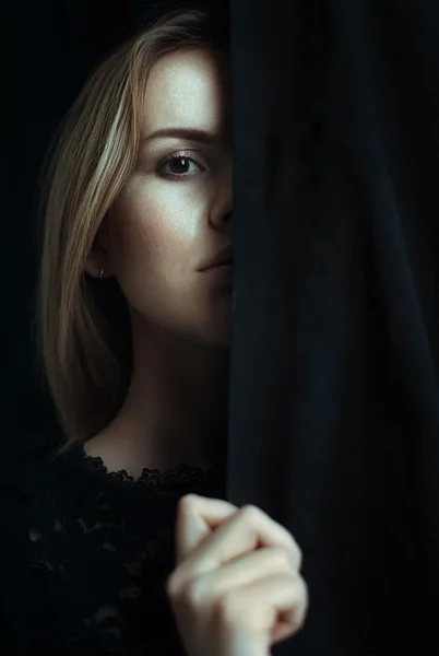 Portrait of a young girl with clean skin on a black background — Stock Photo, Image