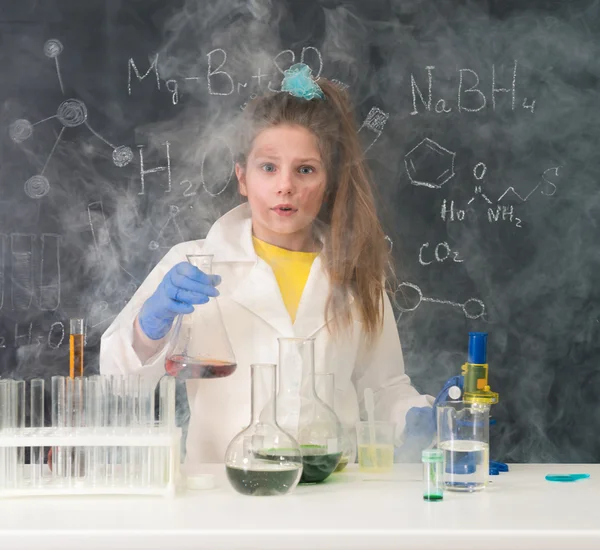 Excited schoolgirl in fume after chemical experiment — Stock Photo, Image