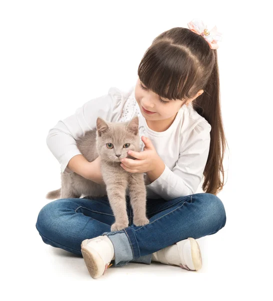 Cute little girl with cat in hands — Stock Photo, Image