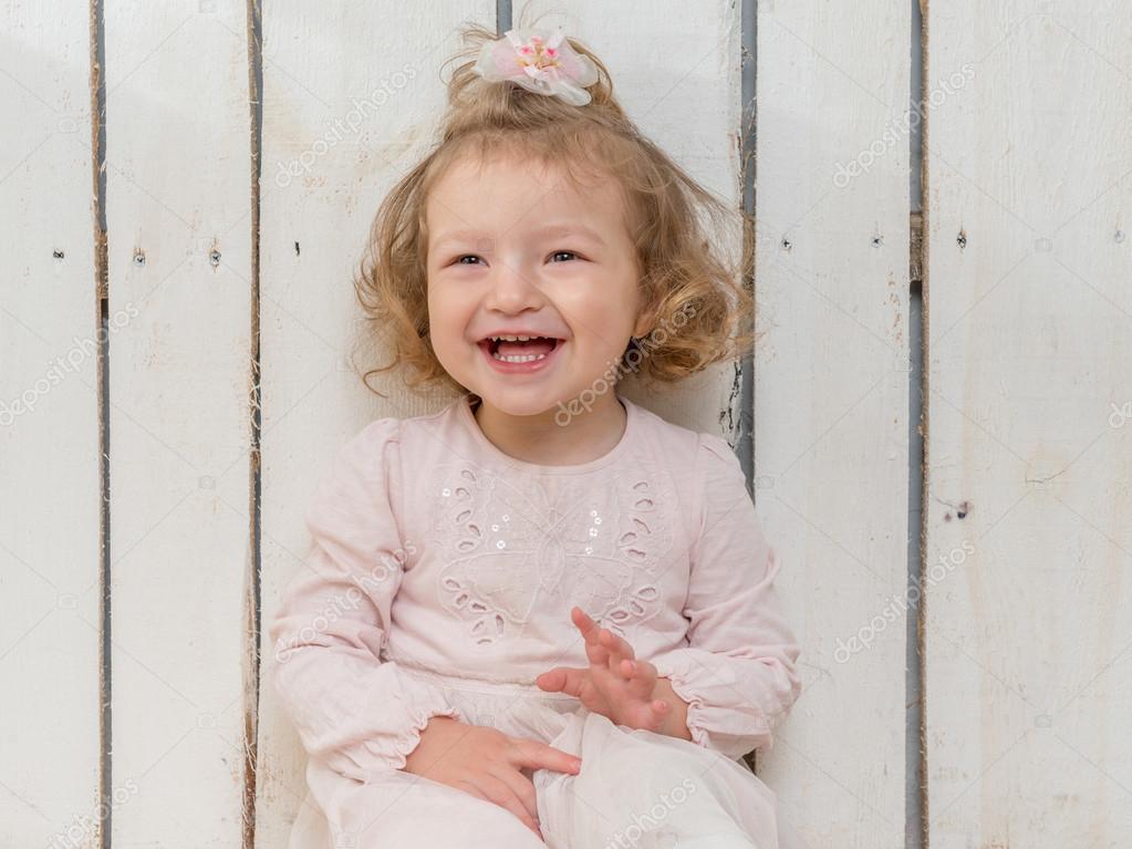 Lovely Little Girl With Funny Hairstyle Laughing Stock Photo
