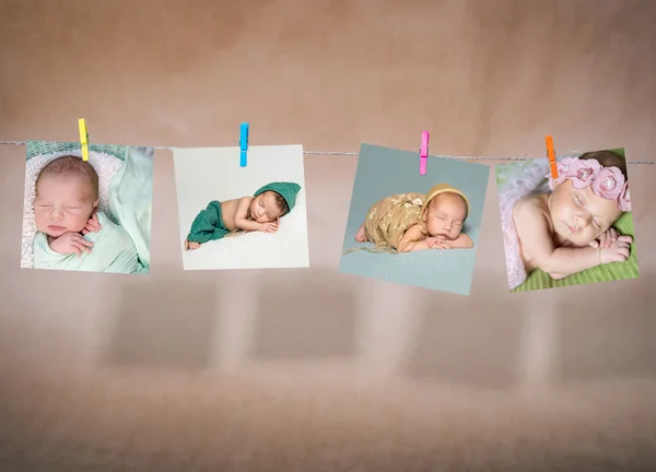 Paper cards of babies hanging on the rope — Stock Photo, Image