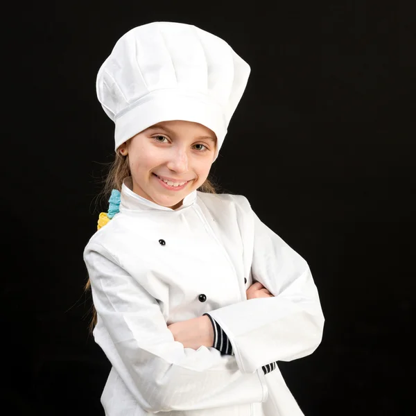 Usmívající se dívka v kostým bílým kuchař — Stock fotografie