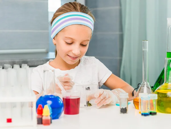 Little girl with flasks for chemistry — Stock Photo, Image