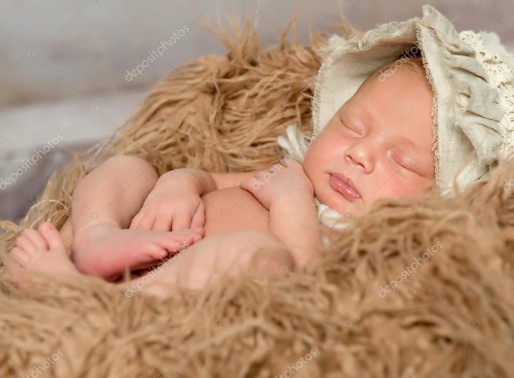 Newborn baby sleeping on fluffy blanket — Stock Photo © tan4ikk 111936278